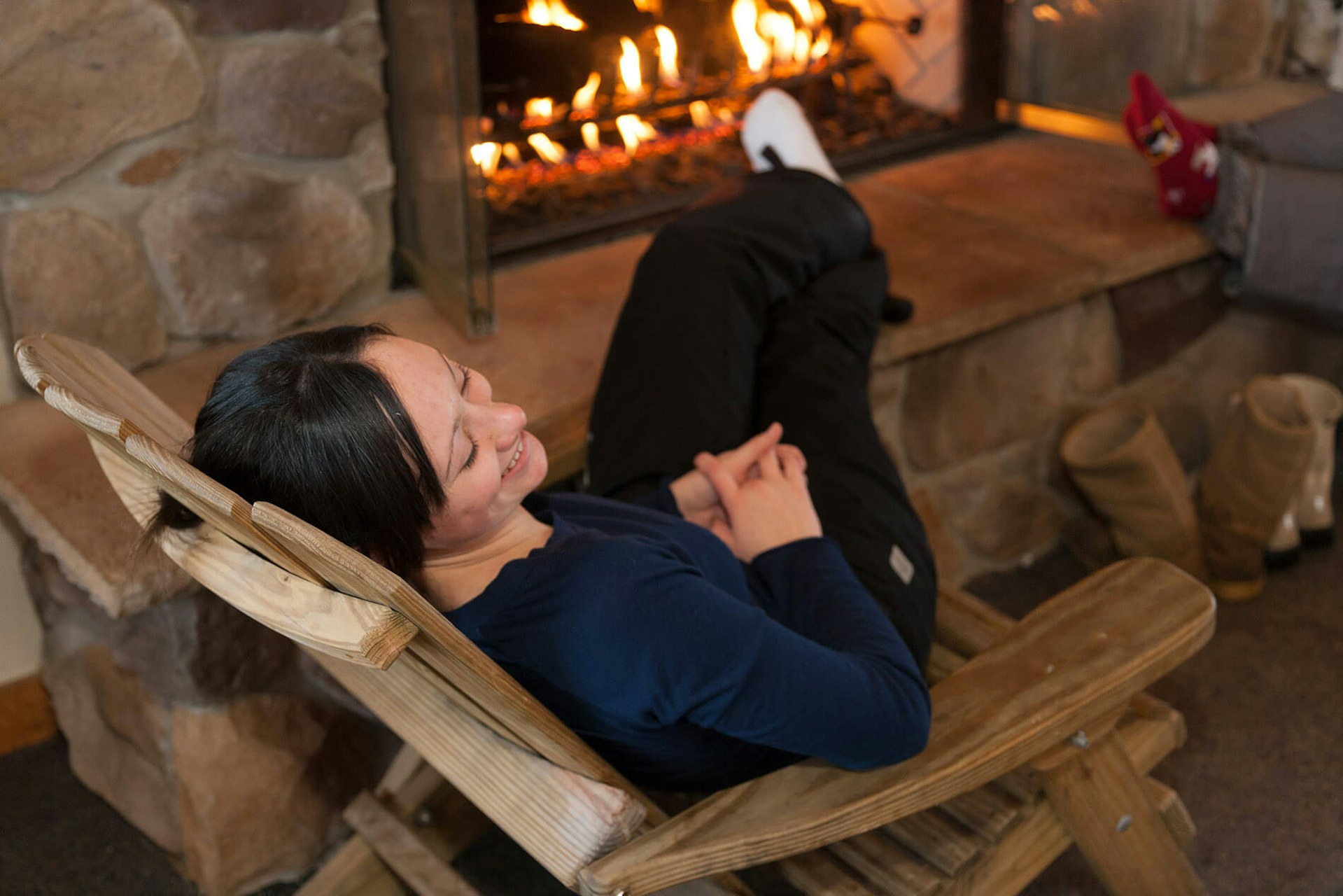 Woman In front of Fireplace