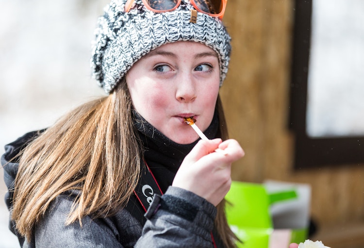 Girl Eating Maple Syrup Sucker