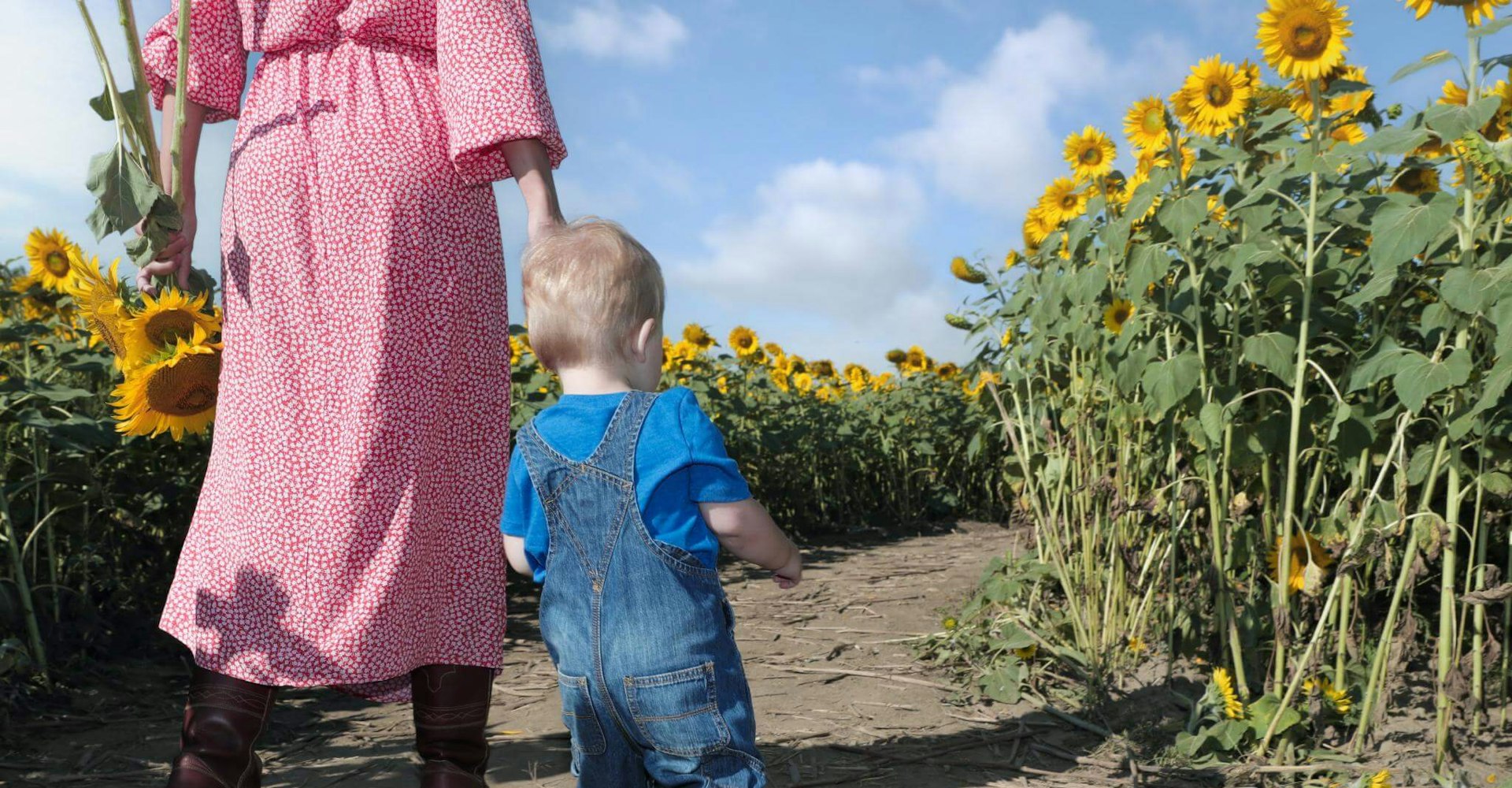 Boy and Mother in Sunflower Field